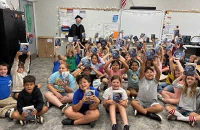 Volunteers for Literacy Inspire Students with “Class of ’35” Dictionary Presentations