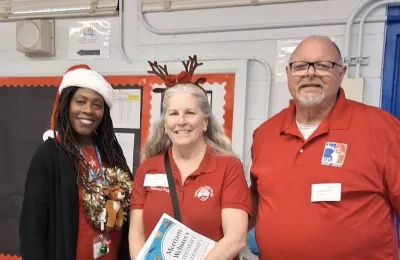 Elks Lodge “Elf Helpers” Deliver Dictionaries and Smiles to Local Students