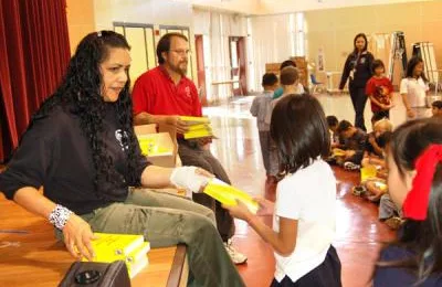 Third graders receive dictionaries from rink
