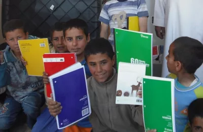 Help us Learn, Give us Hope distribute dictionaries to children in Iraq, Afghanistan